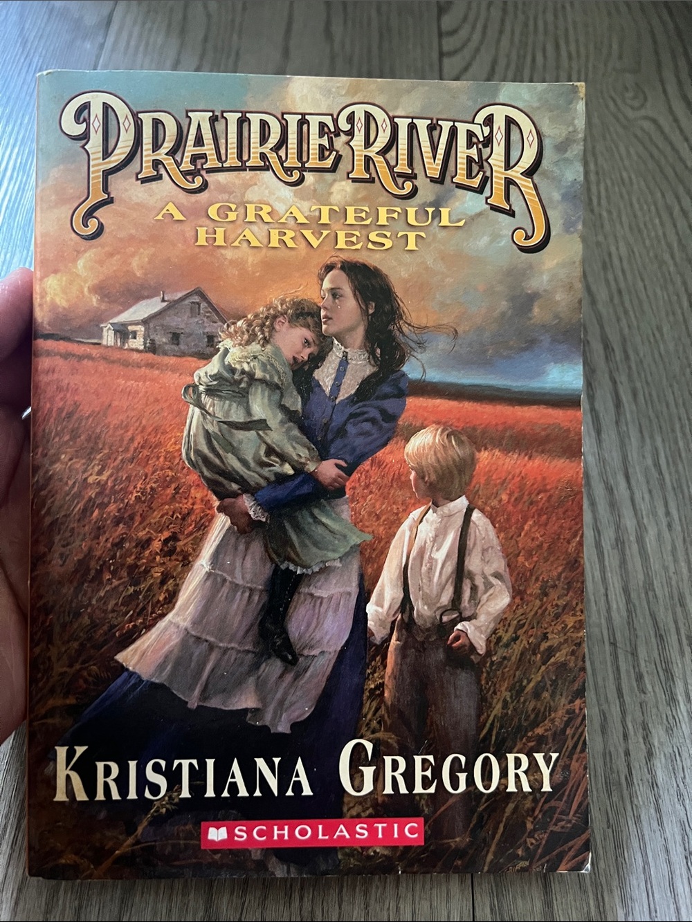 Scholastic Prairie River paperback with red-orange and cream cover art